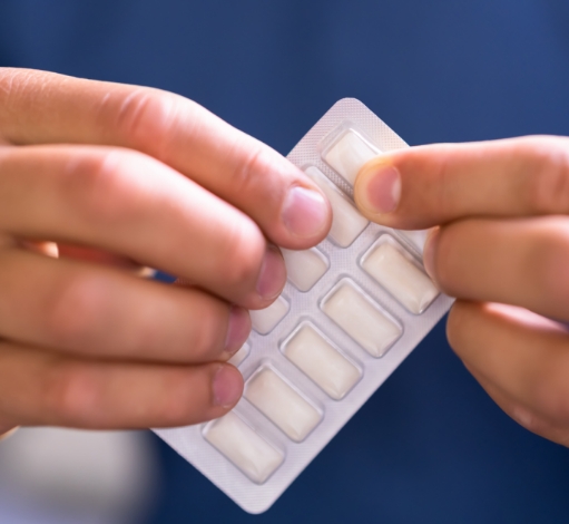 Opening a pack of Nicotine gum.