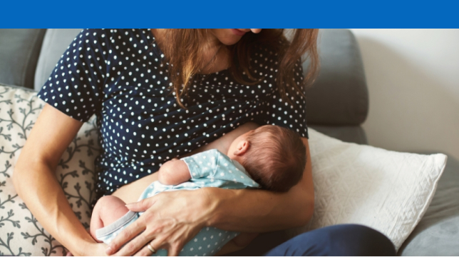 Woman holding a baby.